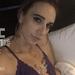 Toms River escort Roxie Rebel reclines in purple lace lingerie.
